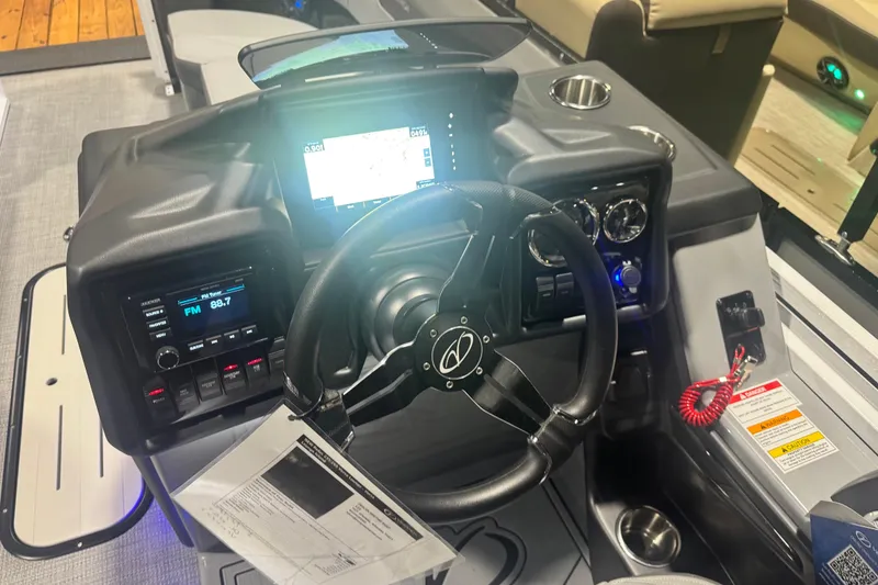 Slide: The Image of 2026 Veranda Relax VR235VL boat dashboard with steering wheel and digital display. - 7