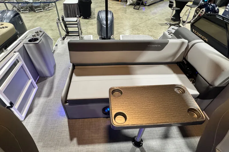 Slide: The Image of 2026 Veranda Relax VR235VL boat interior with seating and table, showcasing modern design. - 9
