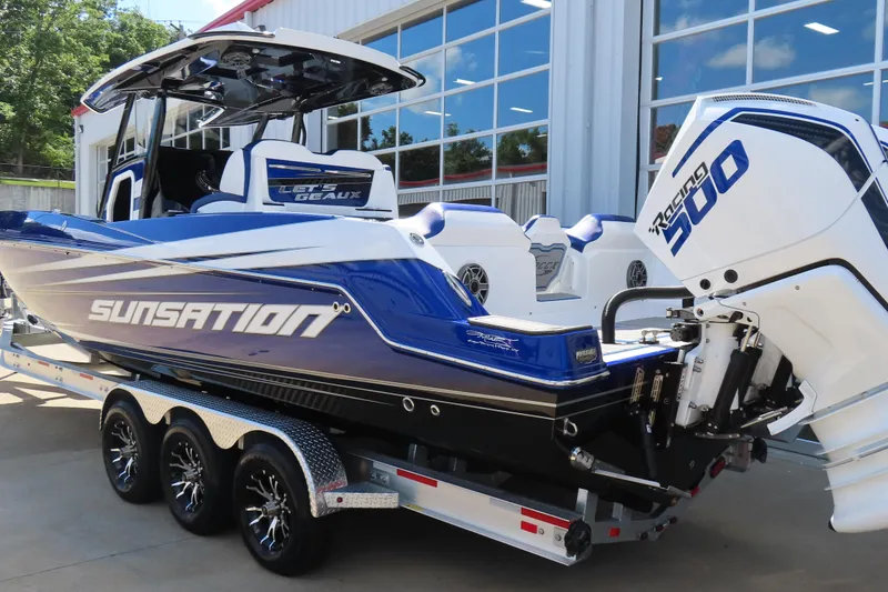 Slide: The Image of 2026 Sunsation 32CCX boat with Racing 300 engine on a trailer. - 10