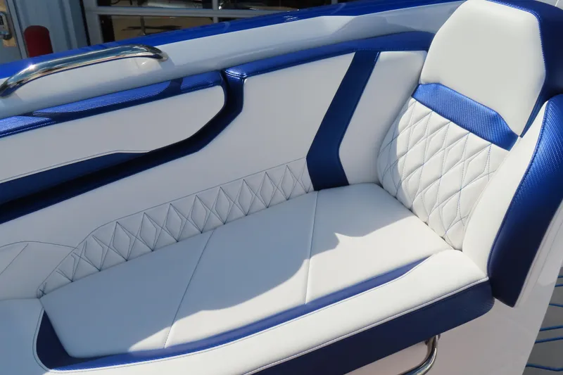 Slide: The Image of Luxurious seating on 2026 Sunsation 32CCX boat with blue and white upholstery. - 19
