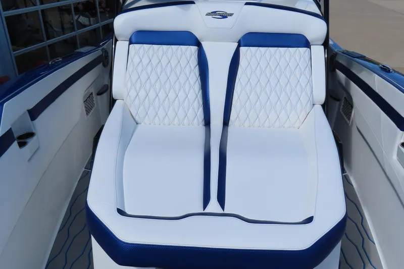 Slide: The Image of 2026 Sunsation 32CCX boat interior with white and blue diamond-stitched seating. - 20