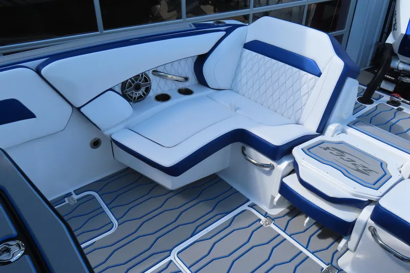 Slide: The Image of 2026 Sunsation 32CCX boat interior with blue and white seating and modern design. - 21