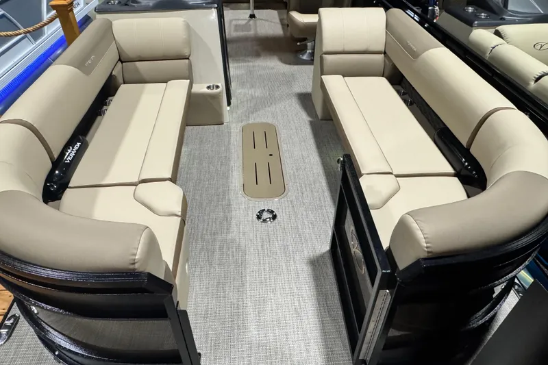 Slide: The Image of 2026 Veranda Relax VR265L pontoon boat interior with beige seating and carpeted flooring. - 3