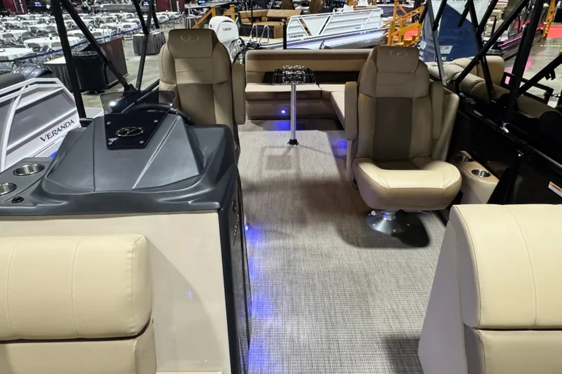 Slide: The Image of 2026 Veranda Relax VR265L pontoon boat interior with beige seating and modern design. - 5