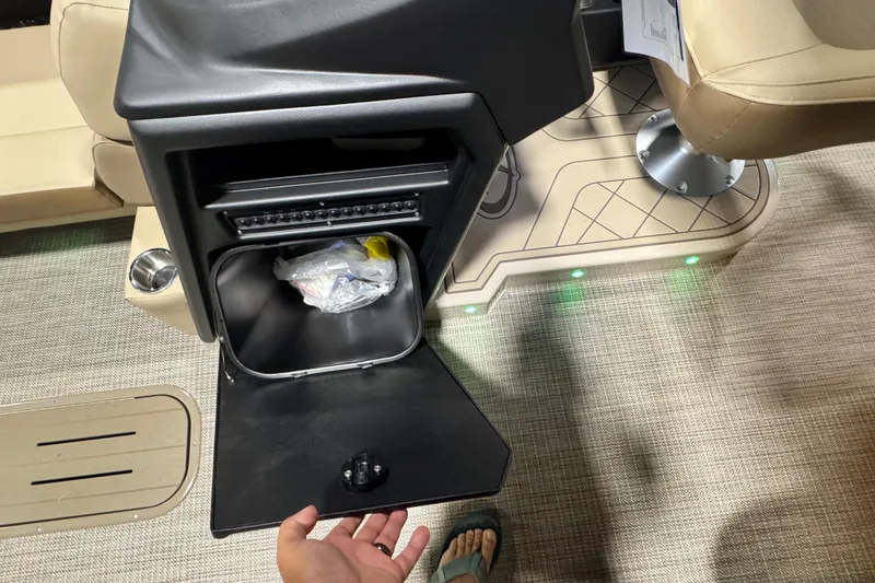 Slide: The Image of Veranda Relax VR265L 2026 boat interior with open storage compartment and LED floor lights. - 7