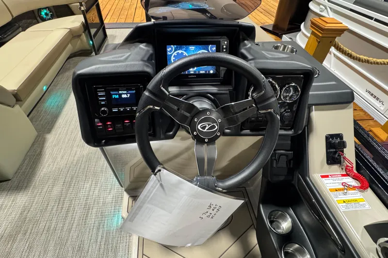 Slide: The Image of 2026 Veranda Relax VR265L boat dashboard with steering wheel and control panel. - 8