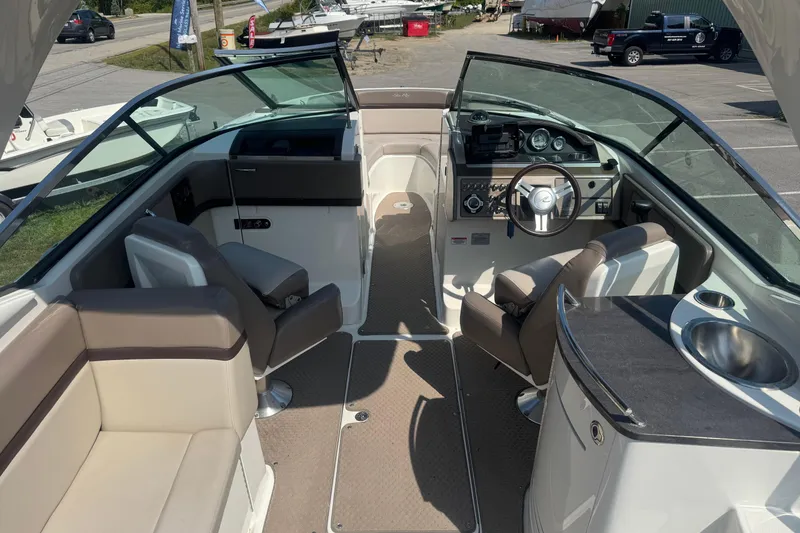 Slide: The Image of 2011 Sea Ray 270 SLX boat interior with seating, steering wheel, and dashboard. - 20