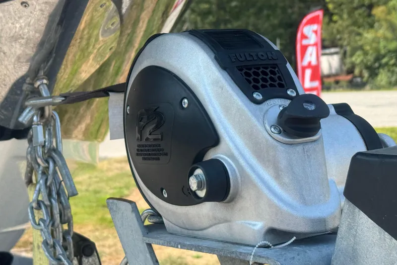 Slide: The Image of Close-up of a Fulton winch on a 2011 Sea Ray 270 SLX boat trailer. - 26