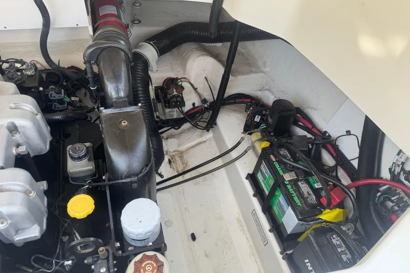 Slide: The Image of Engine compartment of a 2011 Sea Ray 270 SLX boat, showing battery and wiring. - 5