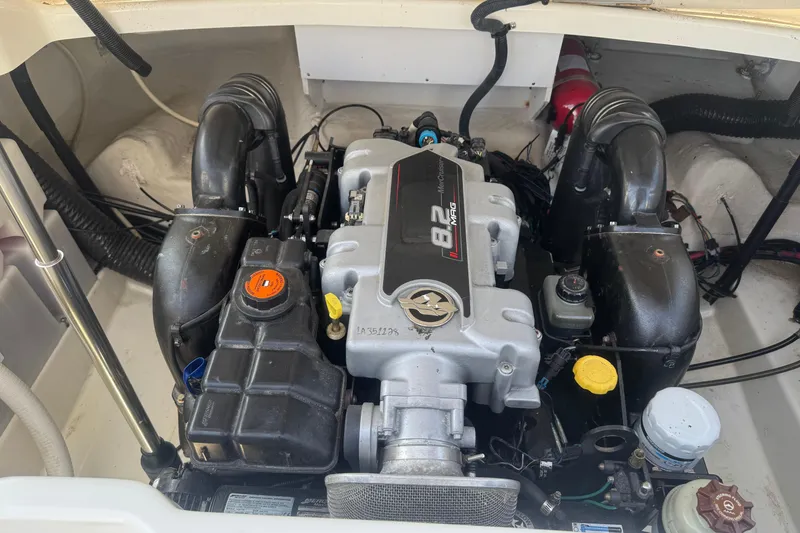 Slide: The Image of Engine compartment of a 2011 Sea Ray 270 SLX boat, featuring an 8.2L engine. - 6
