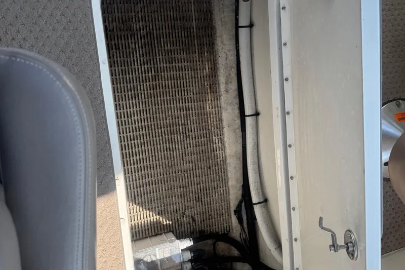 Slide: The Image of Storage compartment of a 2011 Sea Ray 270 SLX boat, showing interior details. - 7