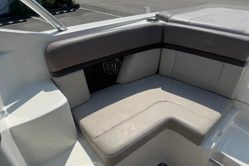 Slide: The Image of 2011 Sea Ray 270 SLX boat interior seating with gray upholstery and cup holder. - 9