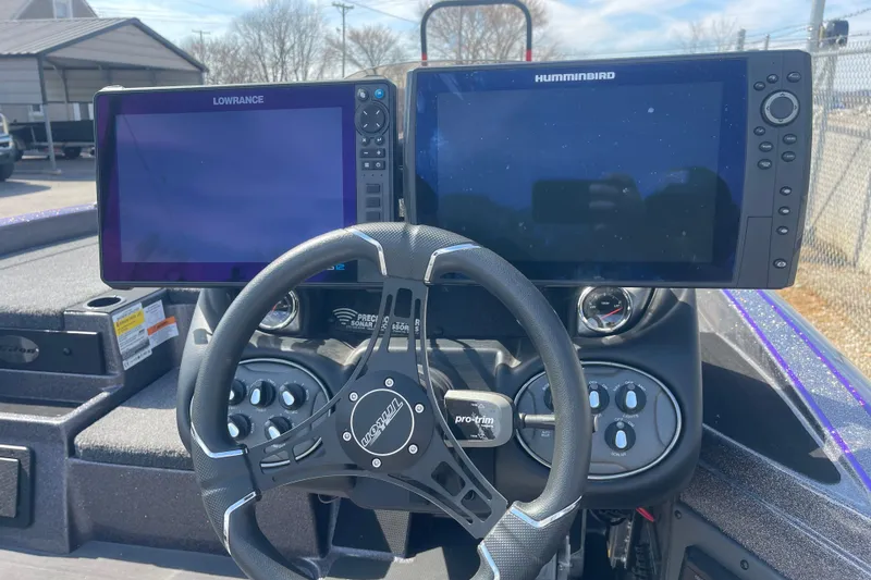 Slide: The Image of 2023 Triton 19TRX Patriot boat dashboard with Lowrance and Humminbird displays. - 6