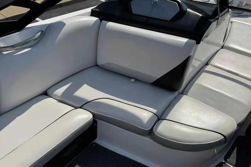 Slide: The Image of 2014 Axis A22 boat interior with white leather seating and sleek design. - 10