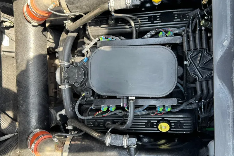 Slide: The Image of 2014 Axis A22 engine compartment with visible components and wiring. - 12