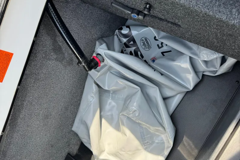 Slide: The Image of 2014 Axis A22 boat ballast bag in storage compartment. - 13