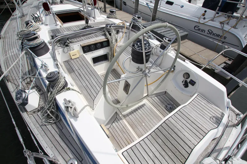Slide: The Image of Cockpit of 1982 Nautor Swan 371 sailboat with wooden deck and steering wheel. - 10
