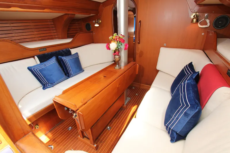 Slide: The Image of Interior of 1982 Nautor Swan 371 yacht with cozy seating and elegant wood finish. - 21