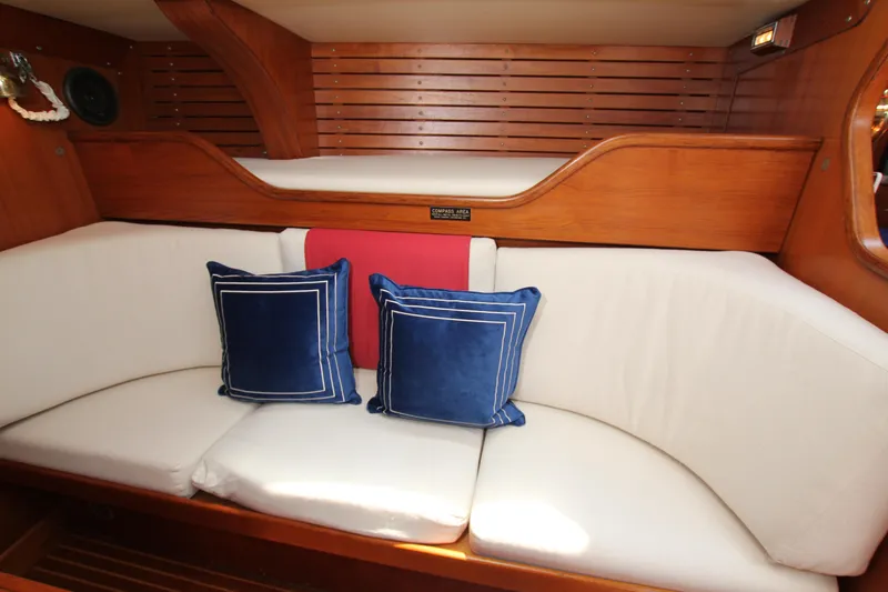 Slide: The Image of Cozy interior of 1982 Nautor Swan 371 yacht with cushions and wooden paneling. - 23