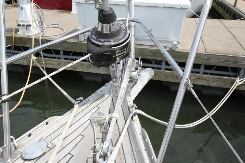 Slide: The Image of Bow of 1982 Nautor Swan 371 sailboat with furling system at dock. - 3