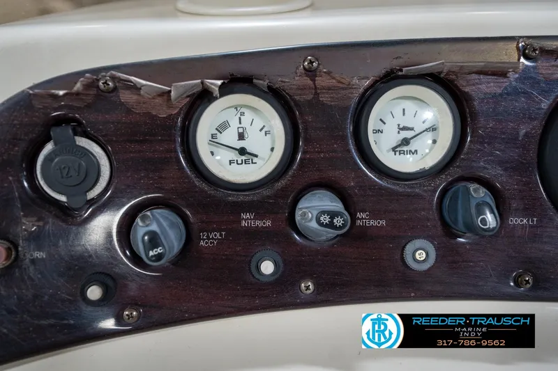 Slide: The Image of Dashboard of a 2004 Bennington 185L boat with fuel and trim gauges. - 29