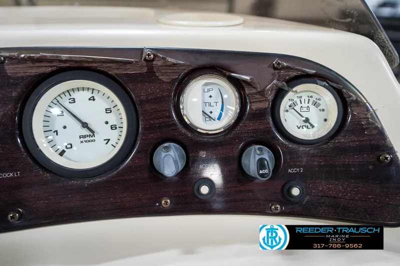 Slide: The Image of Dashboard of a 2004 Bennington 185L boat with RPM and voltage gauges. - 30