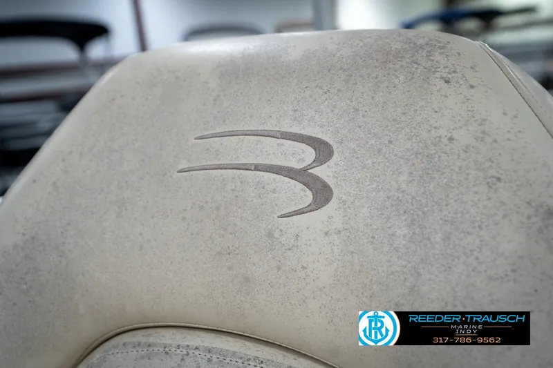 Slide: The Image of Close-up of Bennington 185L 2004 boat seat with logo, Reeder Trausch Marine contact. - 36