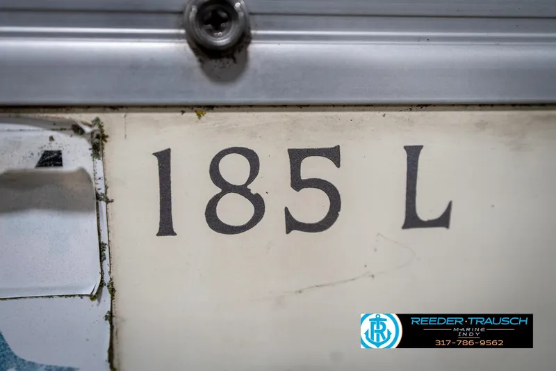 Slide: The Image of Close-up of 2004 Bennington 185L boat model number with Reeder-Trausch Marine logo. - 38