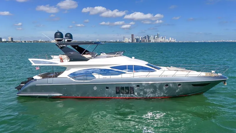 Slide: The Image of Luxurious 2012 Azimut Flybridge yacht cruising on clear blue waters. - 11