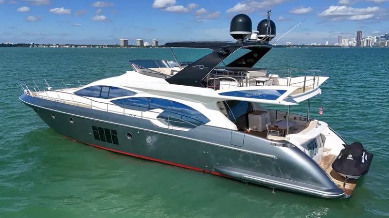 Slide: The Image of 2012 Azimut Flybridge yacht cruising on a sunny day in open waters. - 15