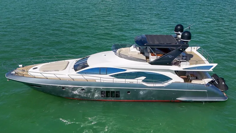Slide: The Image of Azimut Flybridge 2012 yacht cruising on clear green water. - 18