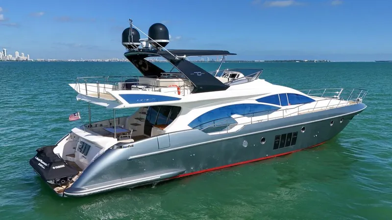 Slide: The Image of Azimut Flybridge 2012 yacht cruising on clear blue waters. - 2