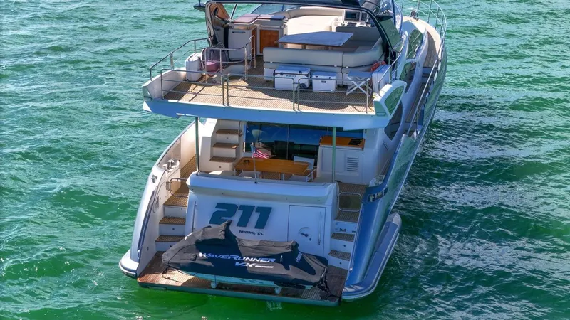 Slide: The Image of Azimut Flybridge 2012 yacht on water, rear view with jet ski. - 22