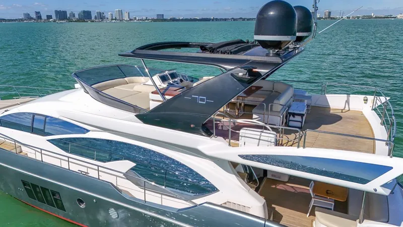 Slide: The Image of Luxurious 2012 Azimut Flybridge yacht cruising on serene waters. - 24