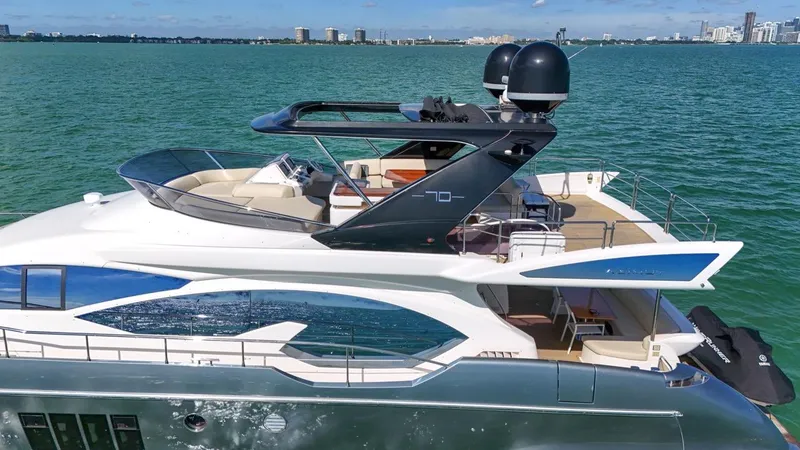 Slide: The Image of Luxurious 2012 Azimut Flybridge yacht cruising on serene waters. - 25