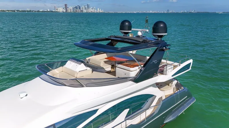 Slide: The Image of 2012 Azimut Flybridge yacht cruising on clear blue waters. - 26