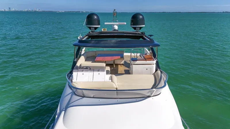 Slide: The Image of Azimut Flybridge 2012 yacht on turquoise water, featuring spacious deck and seating area. - 27