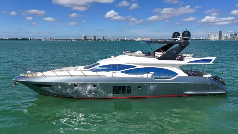 Slide: The Image of 2012 Azimut Flybridge yacht on calm sea with city skyline. - 3