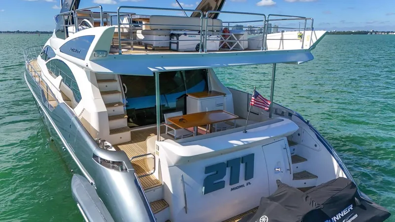 Slide: The Image of Azimut Flybridge 2012 yacht on water, featuring spacious deck and elegant design. - 30