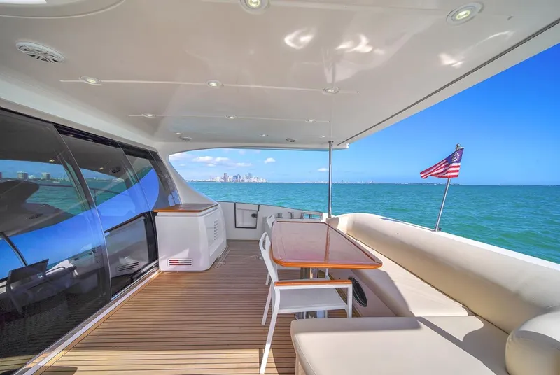 Slide: The Image of Luxurious 2012 Azimut Flybridge yacht deck with ocean view and American flag. - 34
