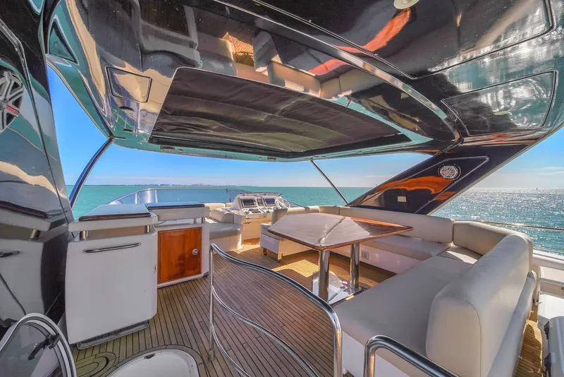 Slide: The Image of Luxurious 2012 Azimut Flybridge yacht interior with ocean view and elegant seating area. - 36