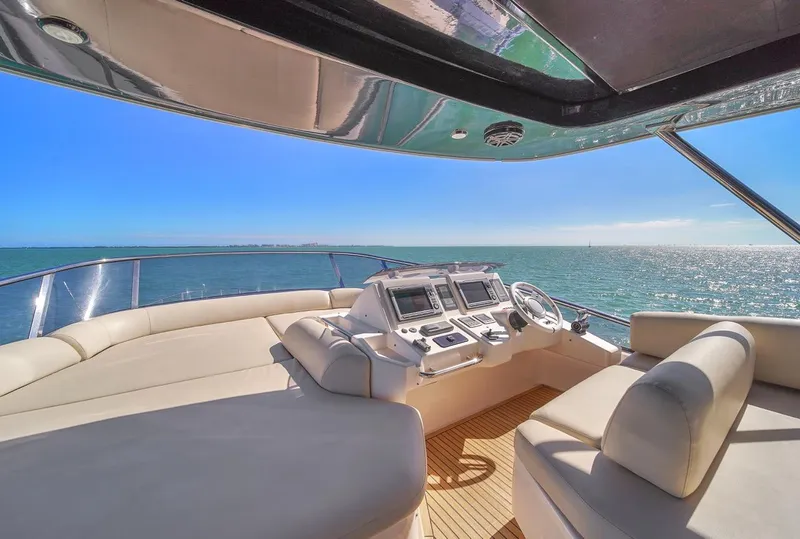 Slide: The Image of Luxurious 2012 Azimut Flybridge yacht interior with ocean view and modern navigation controls. - 38