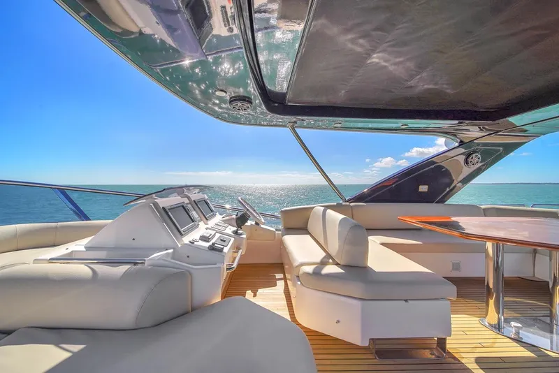 Slide: The Image of Luxurious 2012 Azimut Flybridge yacht interior with ocean view and modern seating. - 39