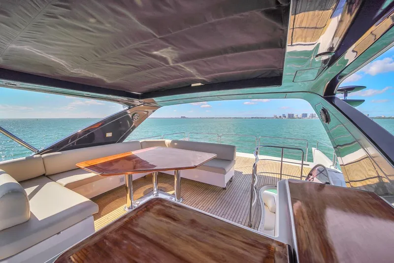 Slide: The Image of Luxurious 2012 Azimut Flybridge yacht interior with ocean view and elegant seating area. - 44