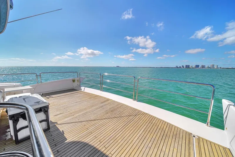 Slide: The Image of Azimut Flybridge 2012 yacht deck with ocean view and clear blue sky. - 45