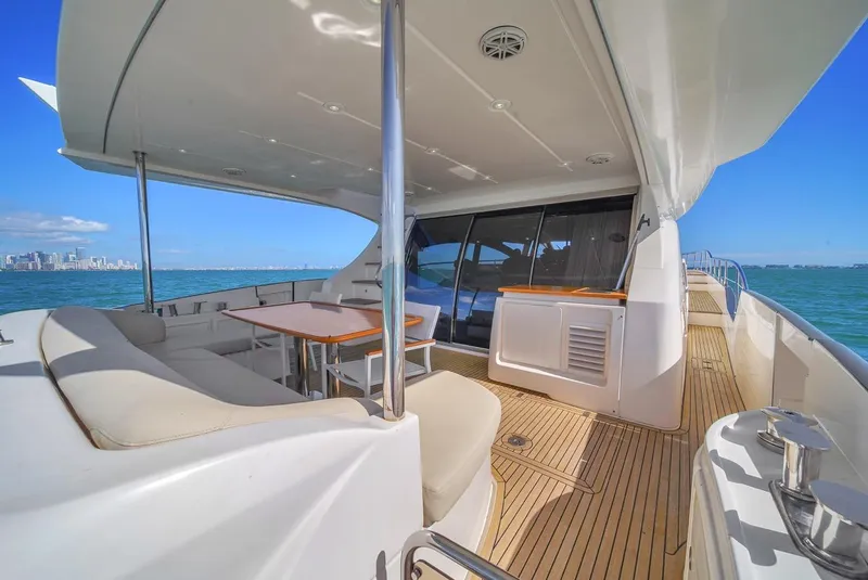 Slide: The Image of Luxurious 2012 Azimut Flybridge yacht with spacious deck and seating area. - 47