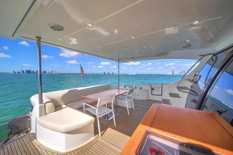 Slide: The Image of Luxurious 2012 Azimut Flybridge yacht deck with ocean view and seating area. - 48