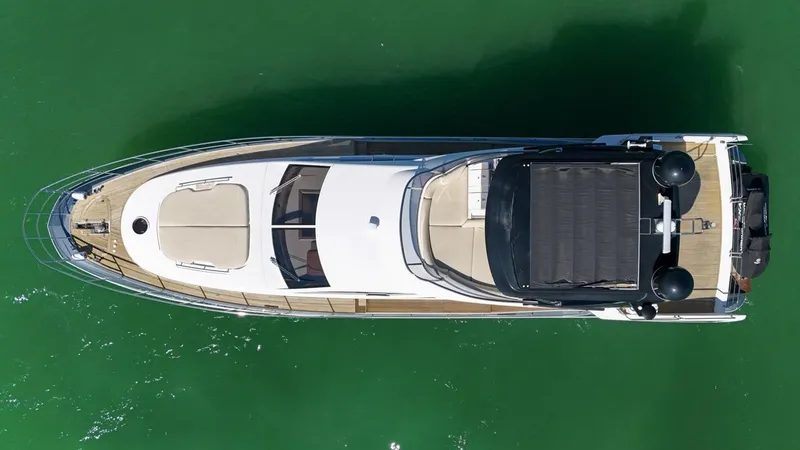 Slide: The Image of Aerial view of 2012 Azimut Flybridge yacht on green water. - 8
