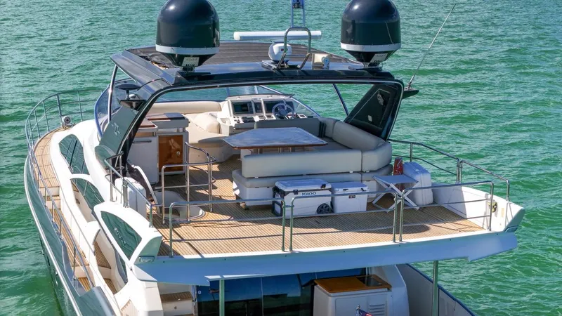 Slide: The Image of Luxurious 2012 Azimut Flybridge yacht on serene water, featuring spacious deck and modern amenities. - 9