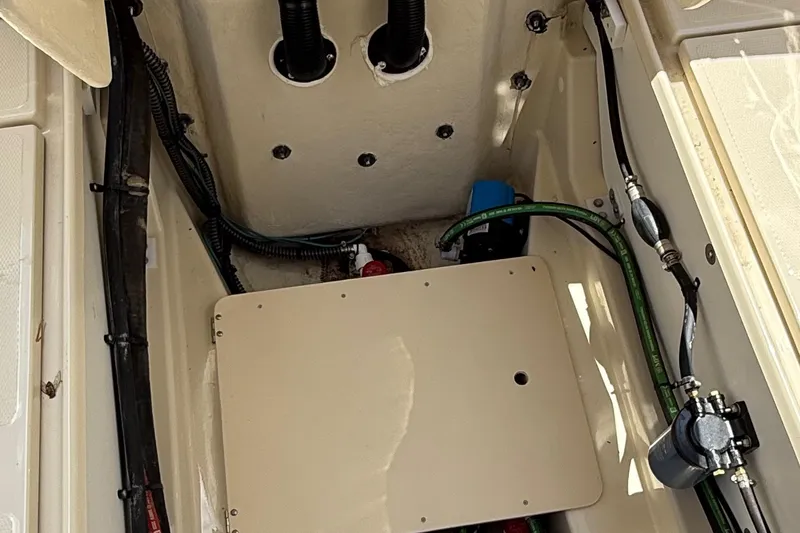 Slide: The Image of 2025 Ranger Tugs R-23 boat interior showing engine compartment and wiring. - 20